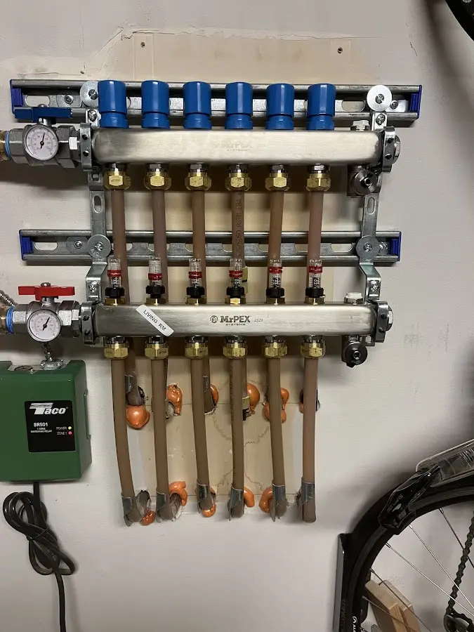 Plumber performing Water Heater Repair at a residential property in Cranford